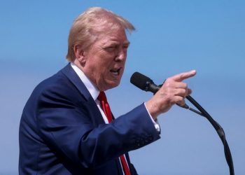 Trump says he is not selling his shares of media company