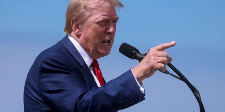 Trump says he is not selling his shares of media company