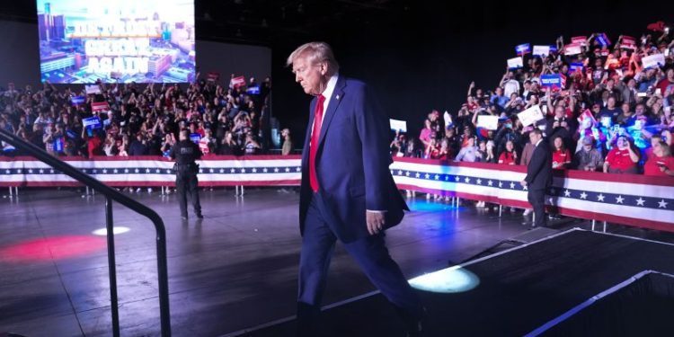 Faulty mic derails Detroit rally as Trump courts city he insulted