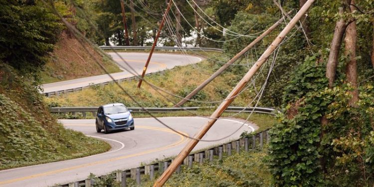 Restoring power to parts of rural US after storm will take weeks, utilities say
