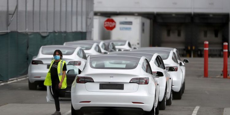 Tesla, Humana lead morning market cap stock movers on Wednesday