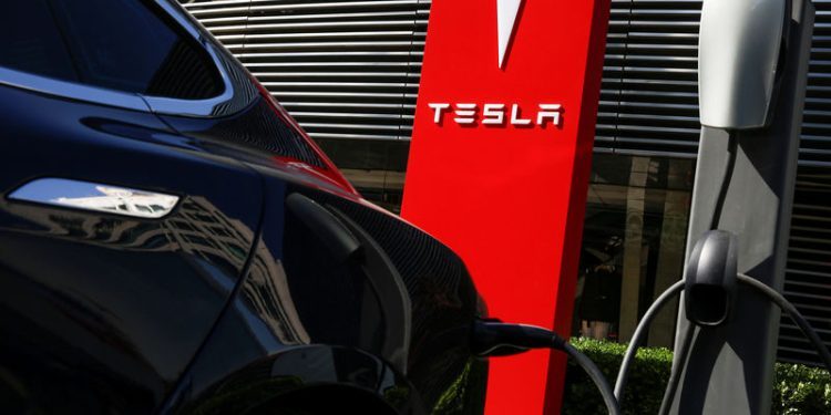 Tesla, Adobe among Friday’s market cap stock movers