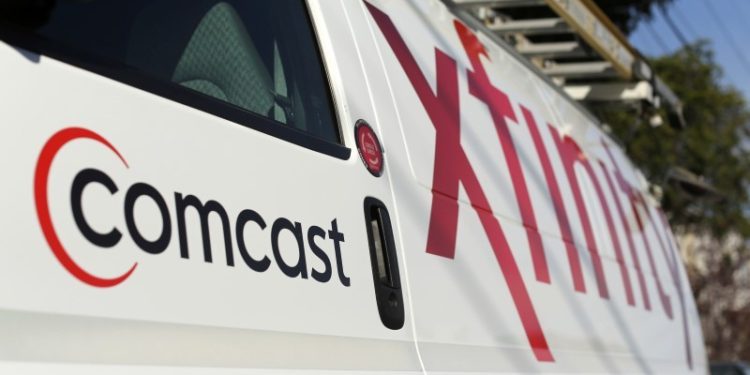 Comcast to proceed with plans to spin off its cable channels, sources say