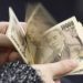 Japanese yen slides past key 155 level after BOJ holds rates steady