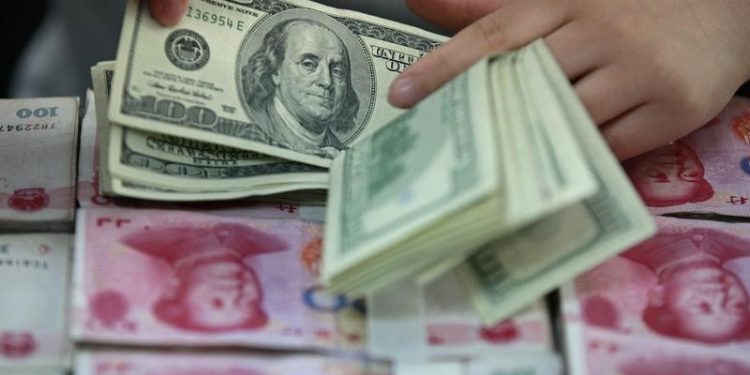 Asia FX slips as dollar firms before the Fed; yuan hit by underwhelming stimulus