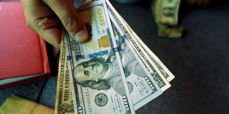 Asia FX muted, dollar slips from 2-yr high on soft inflation data