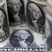 Dollar slips, but on track for hefty gains in 2024