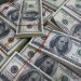 Dollar slips from highs; on track for hefty weekly gains