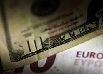 Dollar boosted by rising Treasury yields; euro slips on weak data