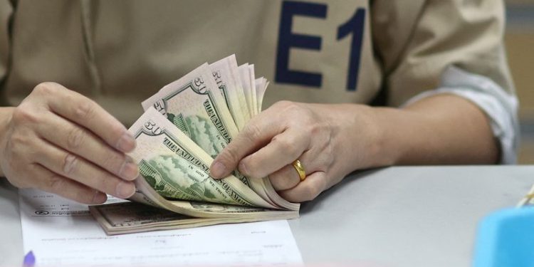 Dollar rally pauses; yuan slides to 16-month low