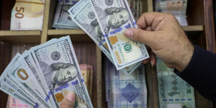 Dollar follows yields higher on solid US data