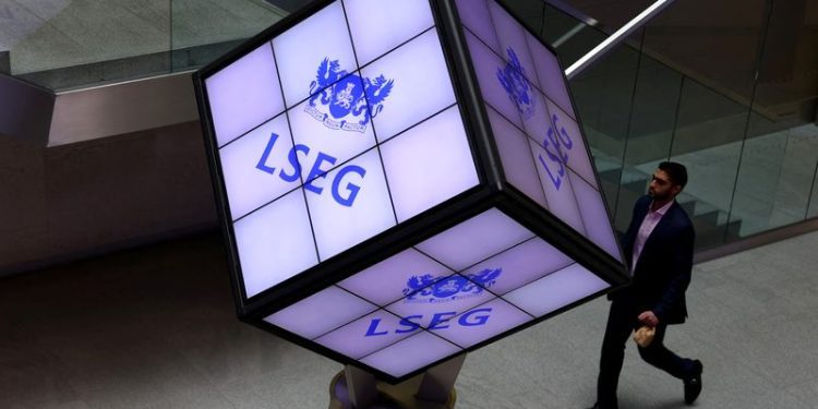 UK midcaps end higher but rate jitters persist, retailers tumble