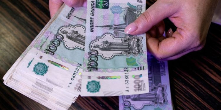 Russian rouble slips as oil price and forex action limit sanctions impact
