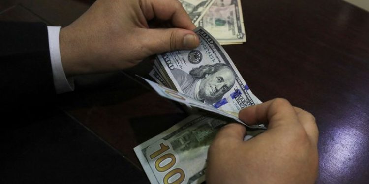 Dollar near 2-year high after rate-cut bets fade, tariffs in focus