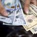 Dollar retains strength ahead of CPI release; sterling weakens again
