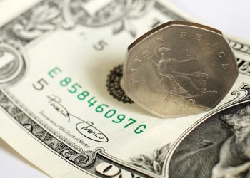 Dollar retains strength ahead of payrolls; sterling slips again